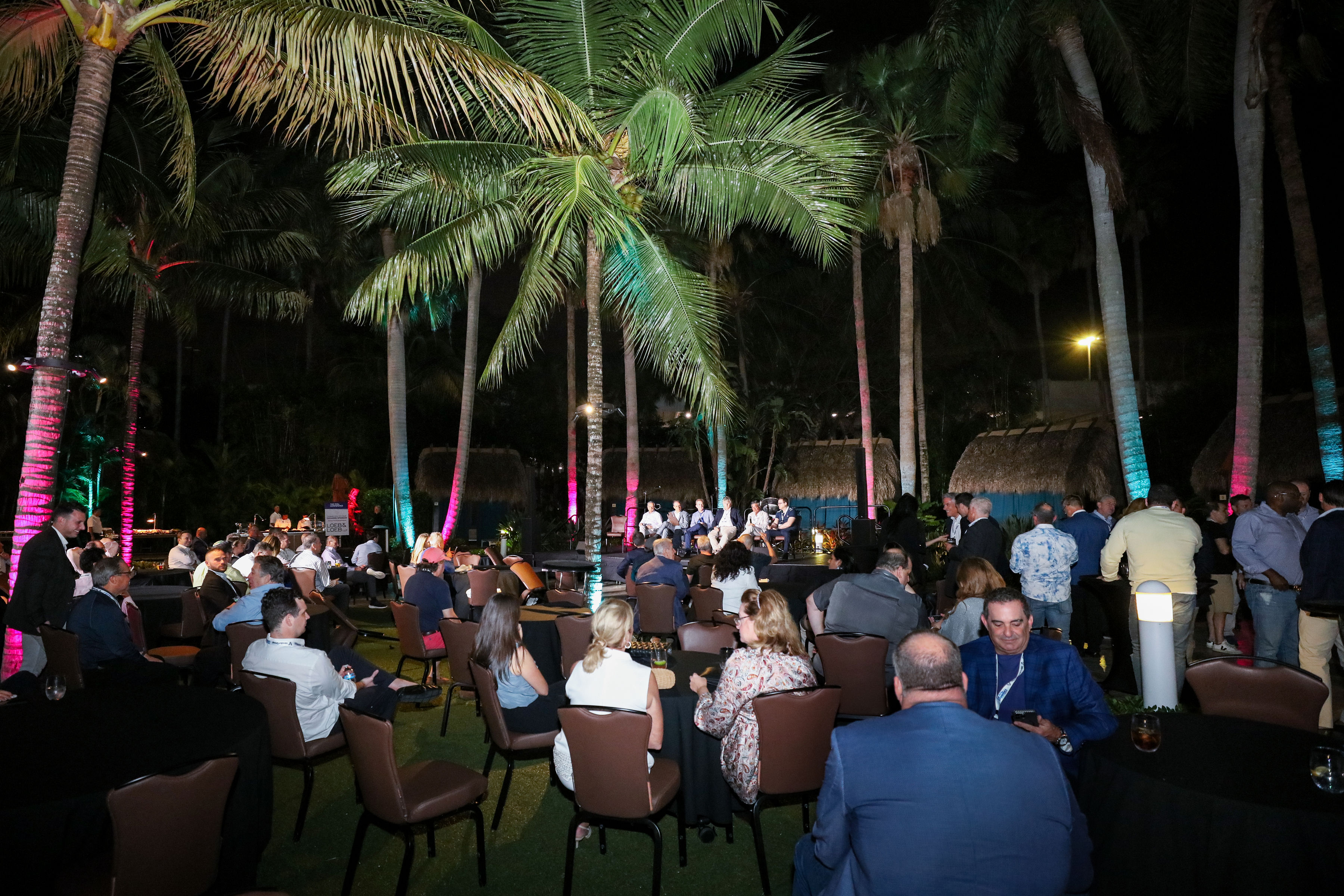 Conference attendees watching a panel discussion
